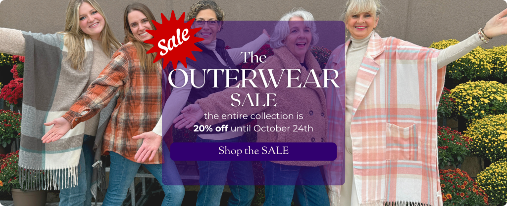 A smiling group of women of various ages stand in carefree poses in a line. Mums are visible around them, and they wear assorted styles of jackets, wraps or coats. Text: the Outerwear SALE - the entire collection is 20% off until October 24th.