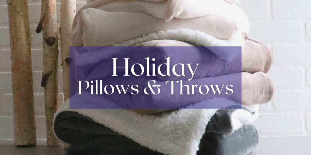 a pile of plush throw blankets