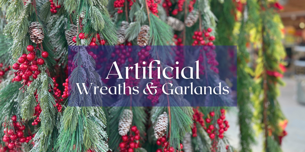 realistic artificial greenery and garland with frosted detail and red berries