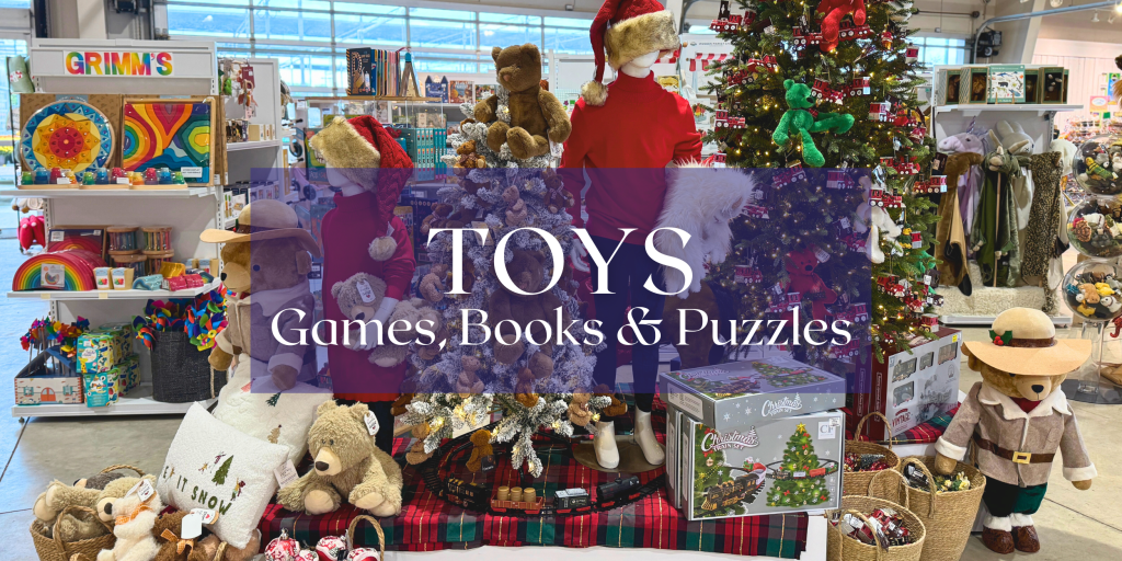 A beautiful assortment of toys and lit Christmas tree in a TERRA Greenhouses store